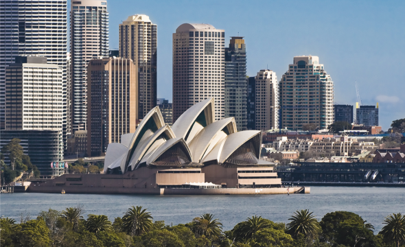 Office buildings and the opera house in Sydney, Australia